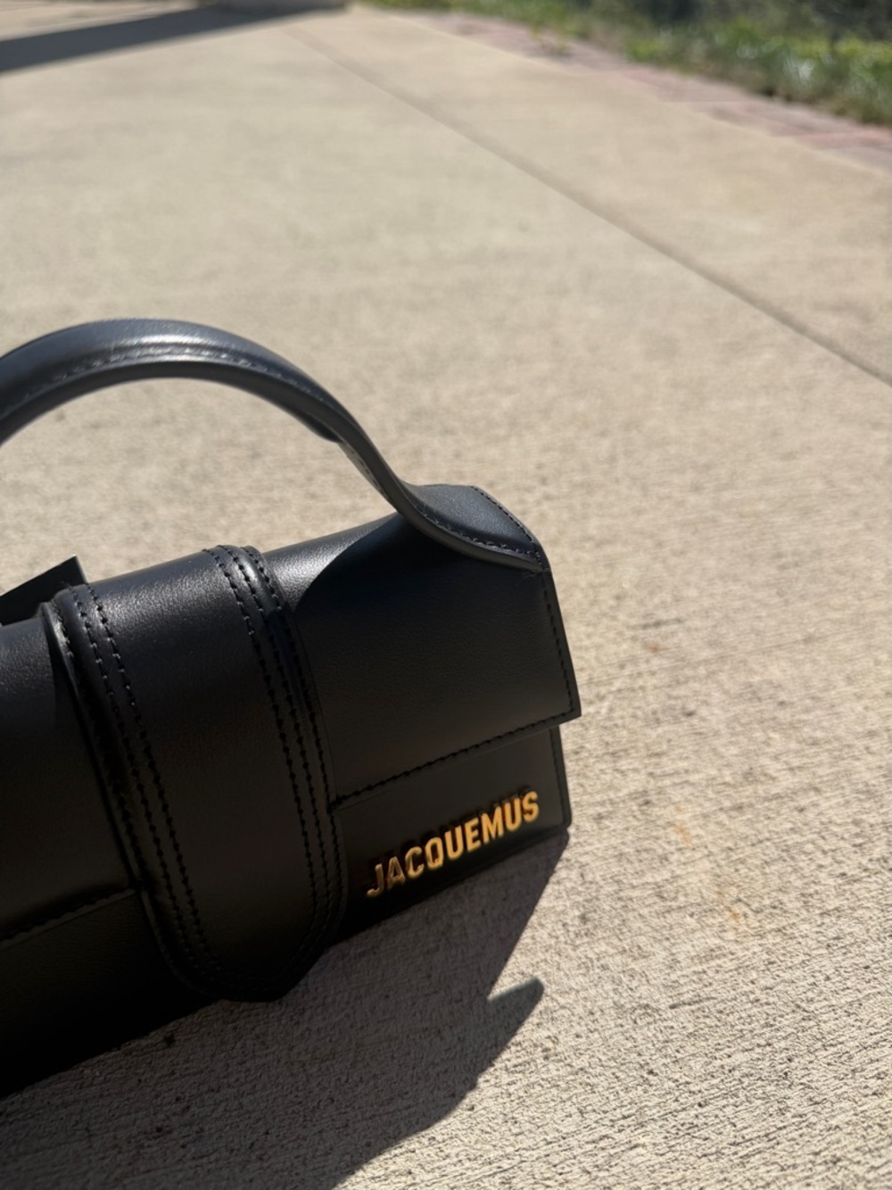 Jacquemus Black Leather Messenger Bag with Gold Logo